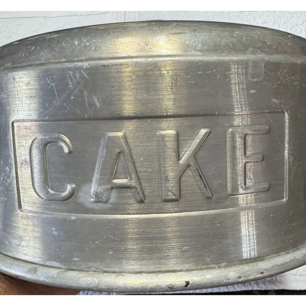 vintage 1950s‎ aluminum cake topper that says in embossed letters 